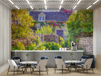 The wallpaper is used as a feature wall in a bedroom.

