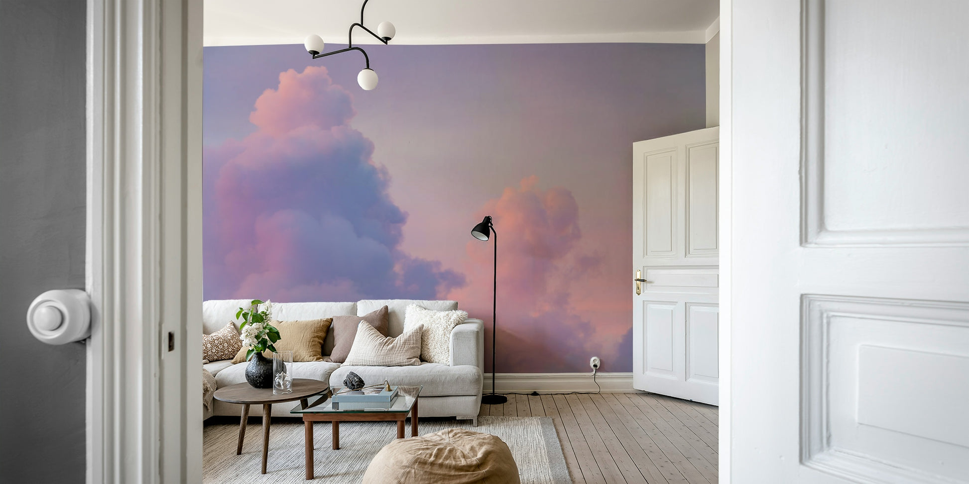 A dreamy pink and purple cloud wall mural for a serene room.

