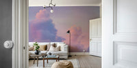 A dreamy pink and purple cloud wall mural for a serene room.

