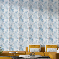 The wallpaper is used as a feature wall in a bedroom.


