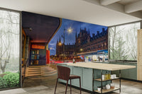 A graceful illuminated building wall mural in rich tones.

