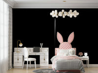 A peaceful black and white mural on decorative wallpaper.


