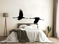 An artistic elegant crane mural on minimalist wallpaper.

