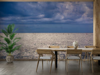 A graceful wave motion wall mural in cool, natural tones.

