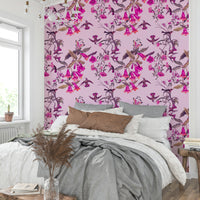 An artistic bird and flower mural on luxury wallpaper.

