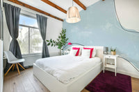 A peaceful modern abstract mural on decorative wallpaper.

