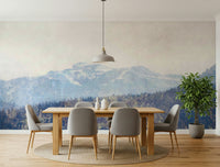 A peaceful mountain range mural on decorative wallpaper.