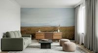A peaceful open country mural on decorative wallpaper.