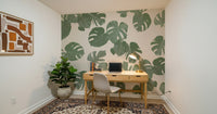 An artistic lush foliage mural on minimalist wallpaper.