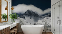 A peaceful mountain range mural on decorative wallpaper.
