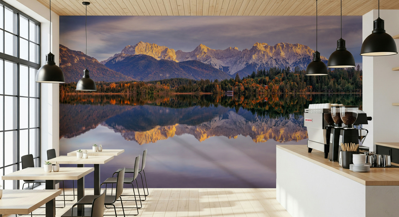 A beautiful panoramic mountain wallpaper mural with golden peaks and a clear water reflection.