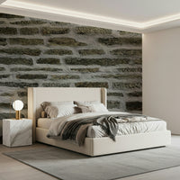 Bedroom accent wall with urban stone wallpaper.