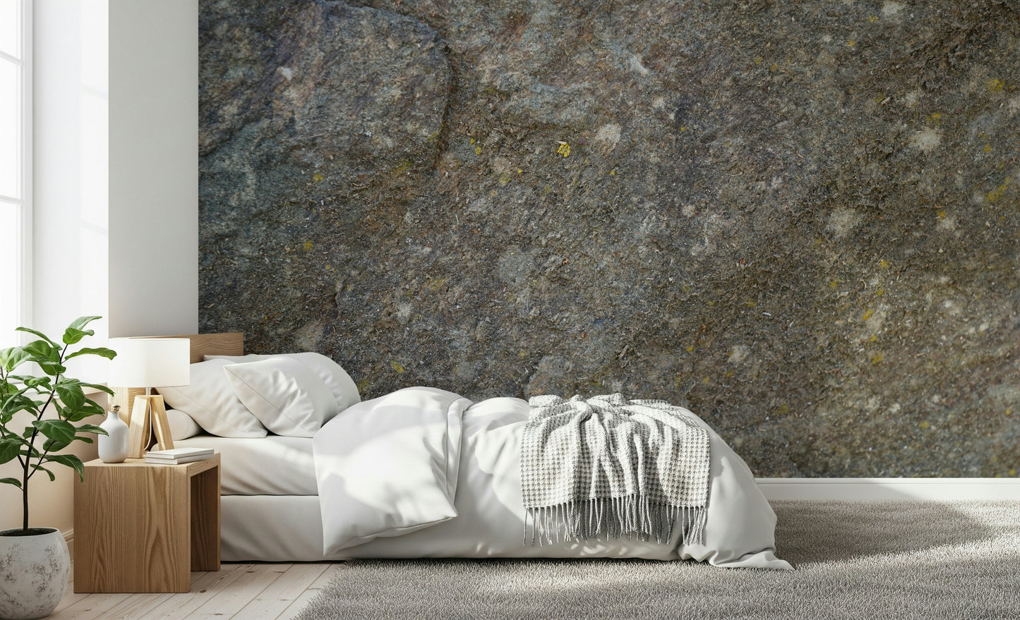 Rustic office space with textured rock surface wall.