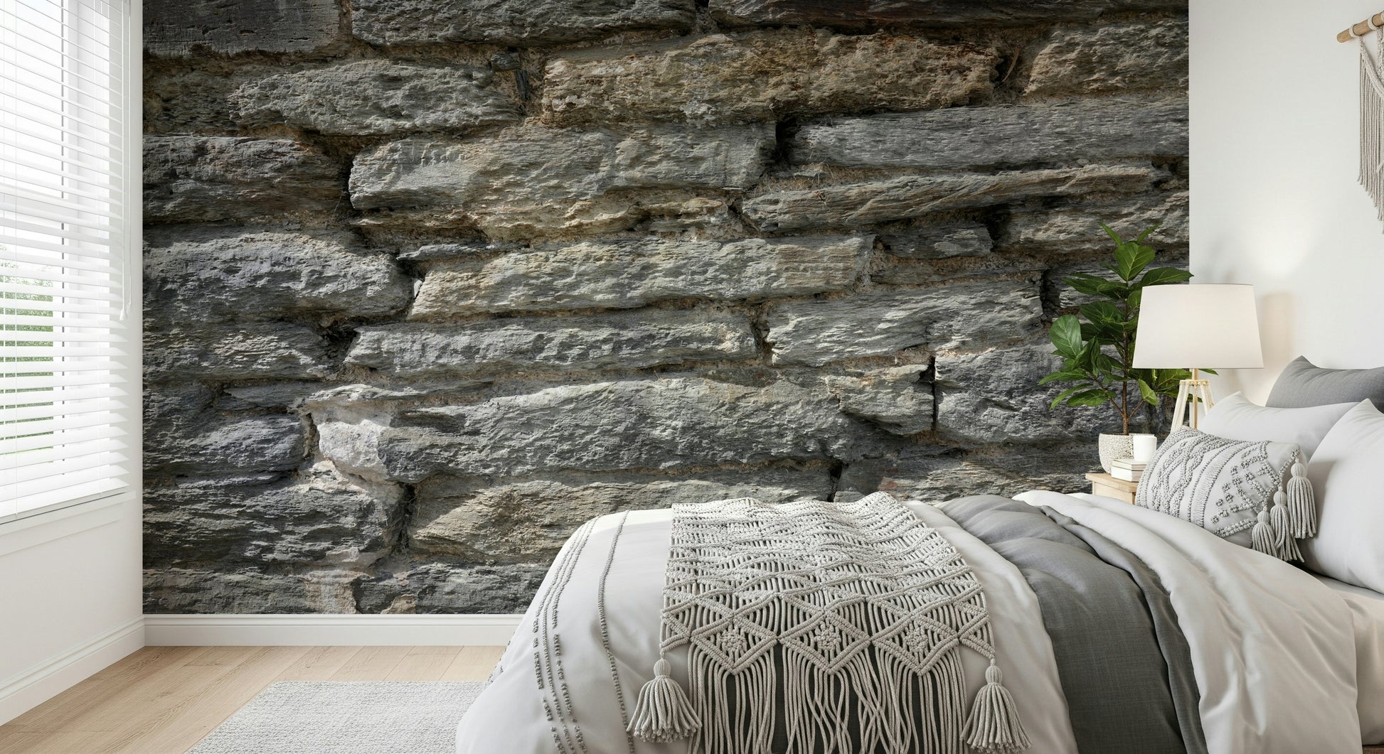 Bedroom accent wall with gray stone texture wallpaper.