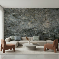 Textured rock mural in a cabin-style room.