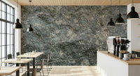 Modern office space featuring textured rock wall.
