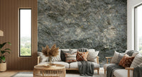 Bedroom accent wall with textured rock wallpaper.