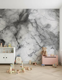 Modern bedroom with gray marble texture accent wall.