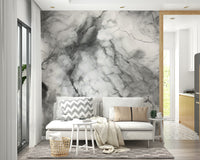 Gray marble wall mural in a sleek kitchen.