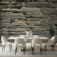 Grey Stone Layers mural behind a minimalist dining table set.