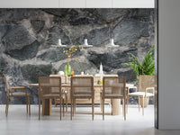 Industrial-style bedroom accent wall with stone block design.