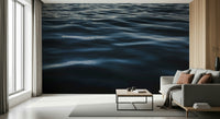 Close-up of blue water ripple wallpaper texture.
