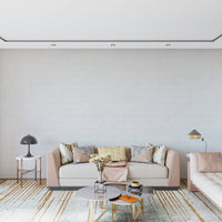 Easy application of the peel and stick whitewashed texture wallpaper.