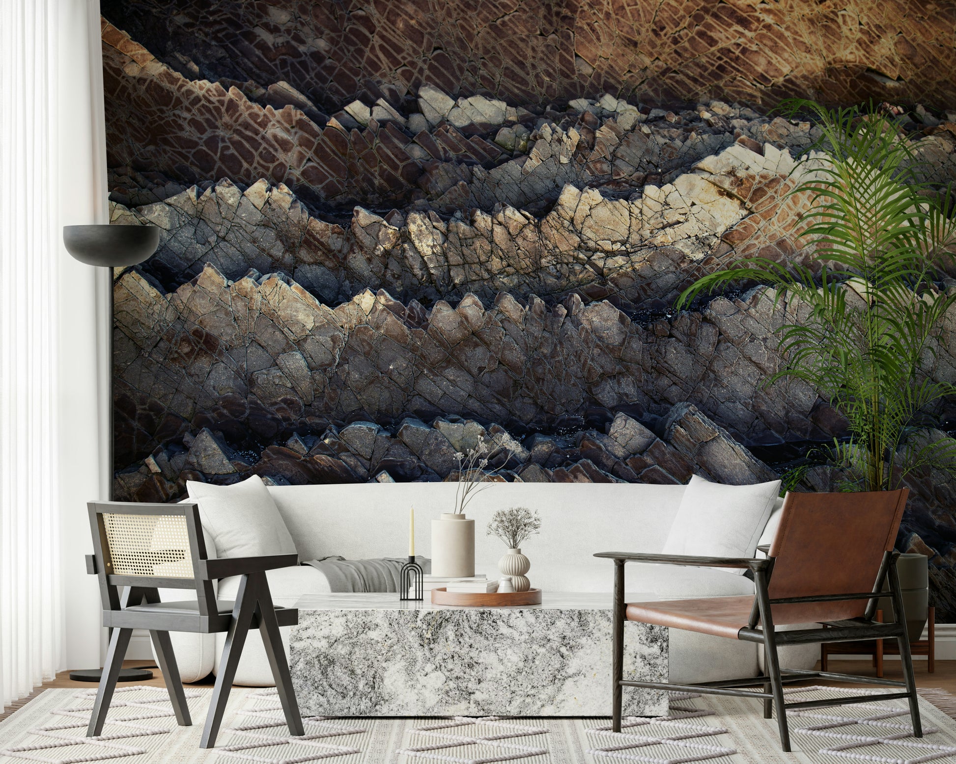Stratified stone wall mural in a rugged living room.