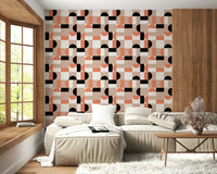 Bold black and peach shapes on textured background.