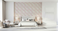 Blush pink and beige patterned wallpaper for walls in a living room.