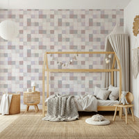 Serene nursery room with the Soft Mosaic blush and beige accent wall.
