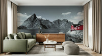 Jagged mountain peaks behind red house on Fjord Home Wall Mural.