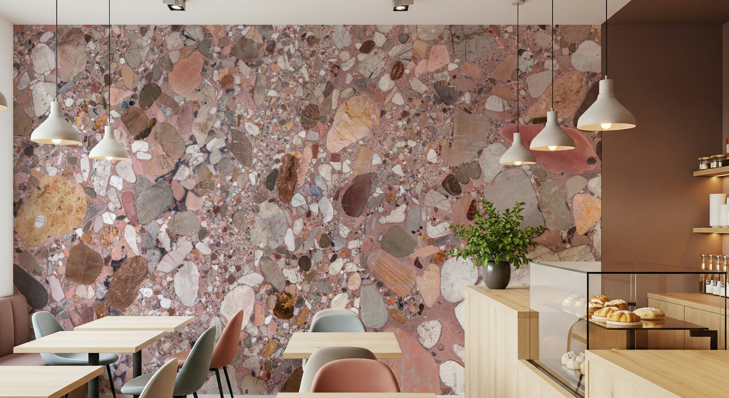 Vibrant Terrazzo Stone mural, large varied aggregate, earthy and rose tones.