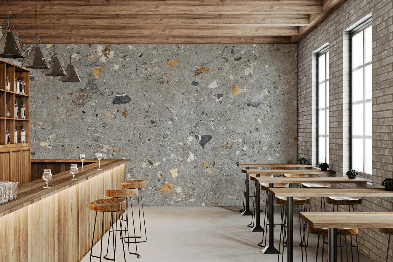 Fossil Stone Grey wallpaper, distinct terrazzo texture, speckled fossils embedded in grey.