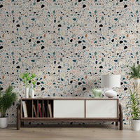 Tiny chips of blush and teal cover vibrant multicolour terrazzo wallpaper art.
