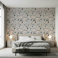 Wide room view showcases the dynamic vibrant multicolour terrazzo wallpaper backdrop.