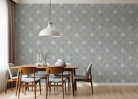 Grey textured mural with repeating white icons