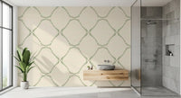 Bathroom feature wall settles into quiet contrast with Beachy Boho Coastal Green Dotted Lattice wallpaper.