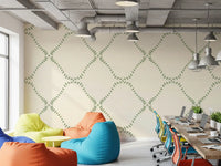 Office workplace behind Beachy Boho Coastal Green Dotted Lattice wallpaper.