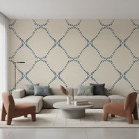 Living room stays calm behind Beachy Boho Coastal Slate Blue Dotted Lattice wallpaper.