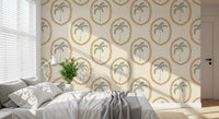 Bedroom backdrop softens behind golden bead ovals on Beachy Boho Palm Oasis Medallion wallpaper.