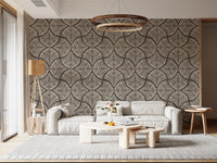 Lounge styling builds around fan-motif wallpaper in cream and deep charcoal.