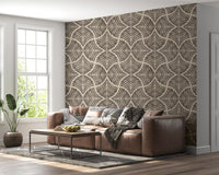 Charcoal scallops fan motifs root a living room in this dark brown Japandi wallpaper.