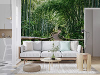 A serene forest path roots a living room in nature through this bamboo wall mural.