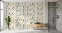 Sage palms and slate blue arcs dress a bathroom with this tropical wallpaper.