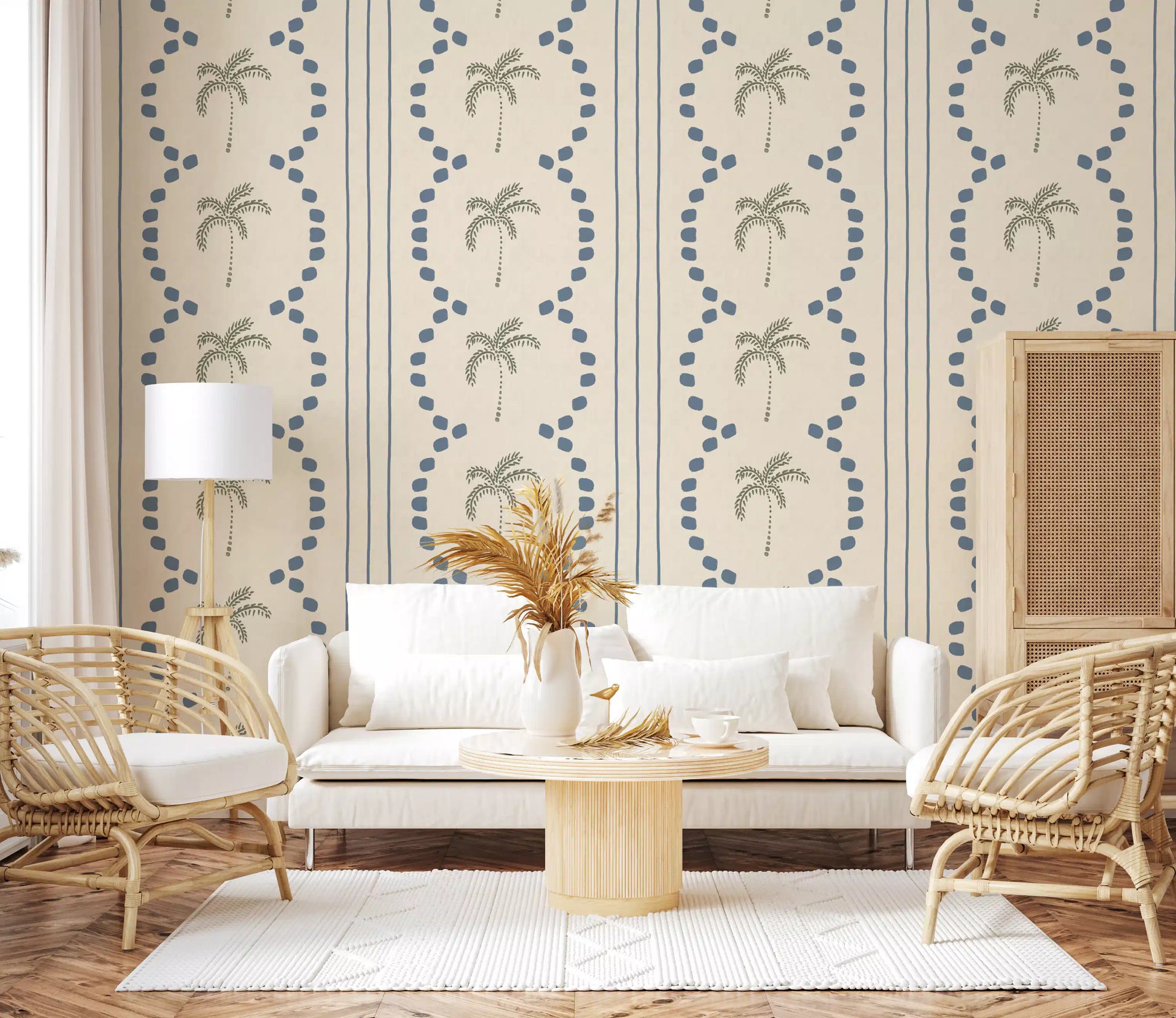 A muted blue and sage tone spreads through this tropical palm wallpaper.