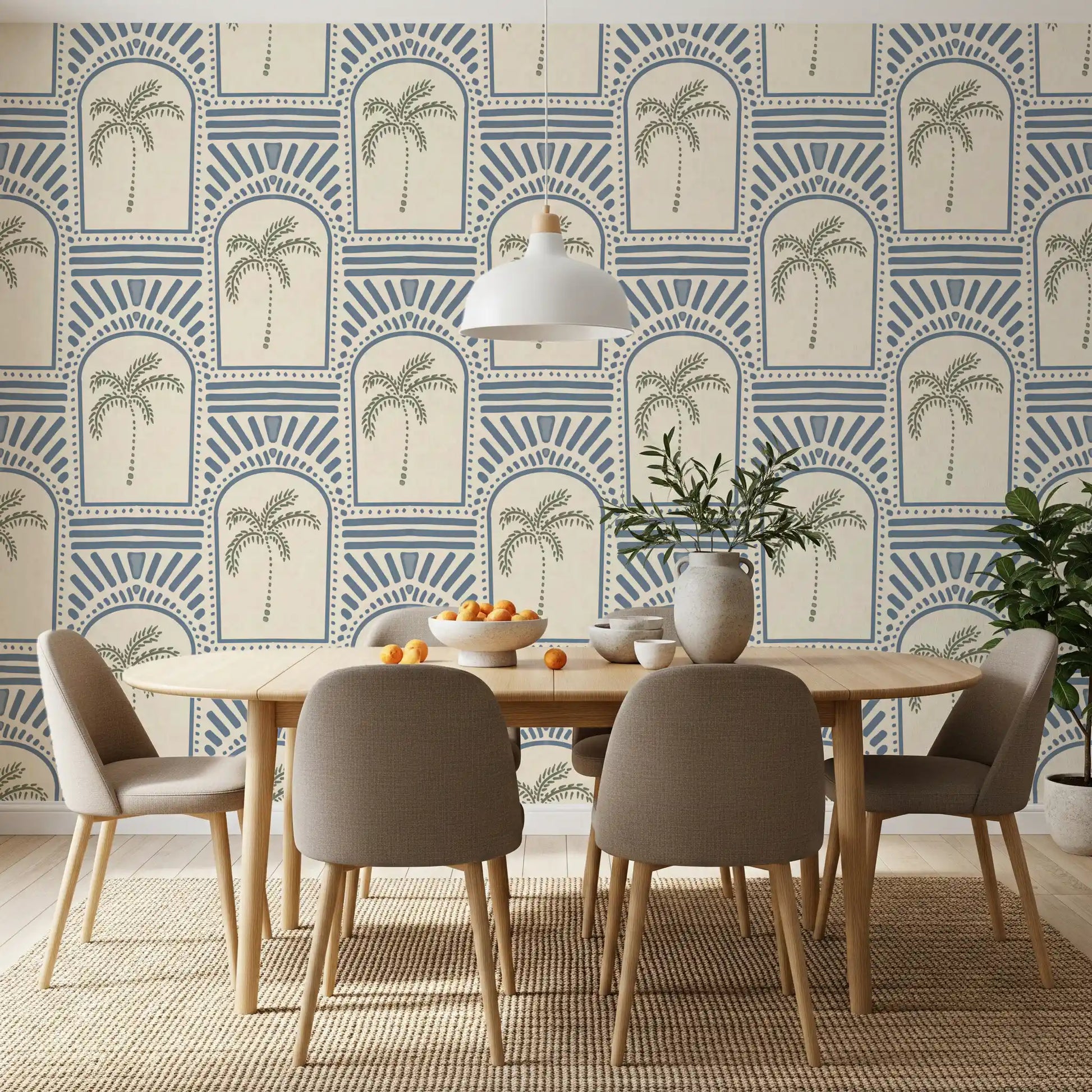 Pure slate blue archway wallpaper rounding a wide dining scene with sage palms inside.
