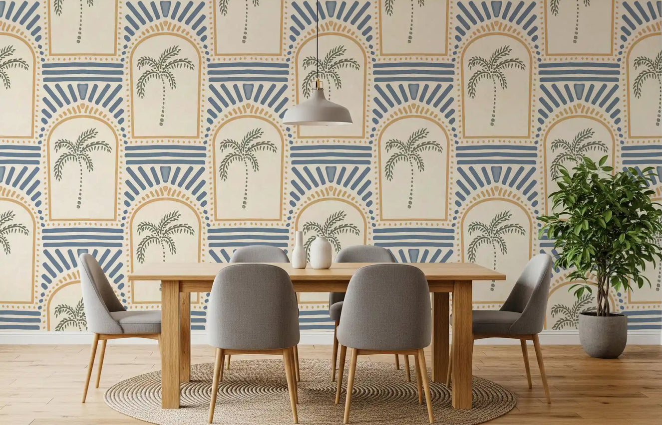 Open dining room with sand archway wallpaper, sage palms, slate blue rays inside arches.