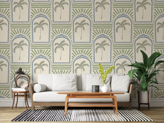 Palm archway wallpaper centering a wide living room in slate blue arches and sage palms.