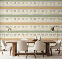 Long dining room scene with Marrakesh Orizzontal striped wallpaper, horizontal palm rows.